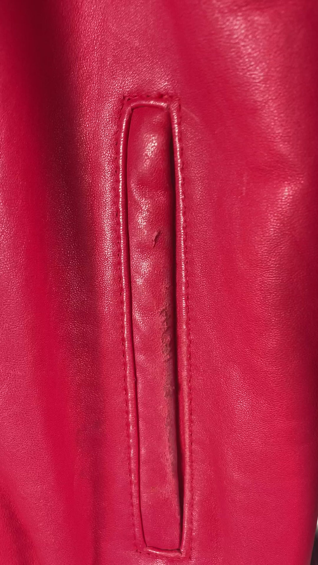 video showing close up on as is details, wear and tear, on jacket