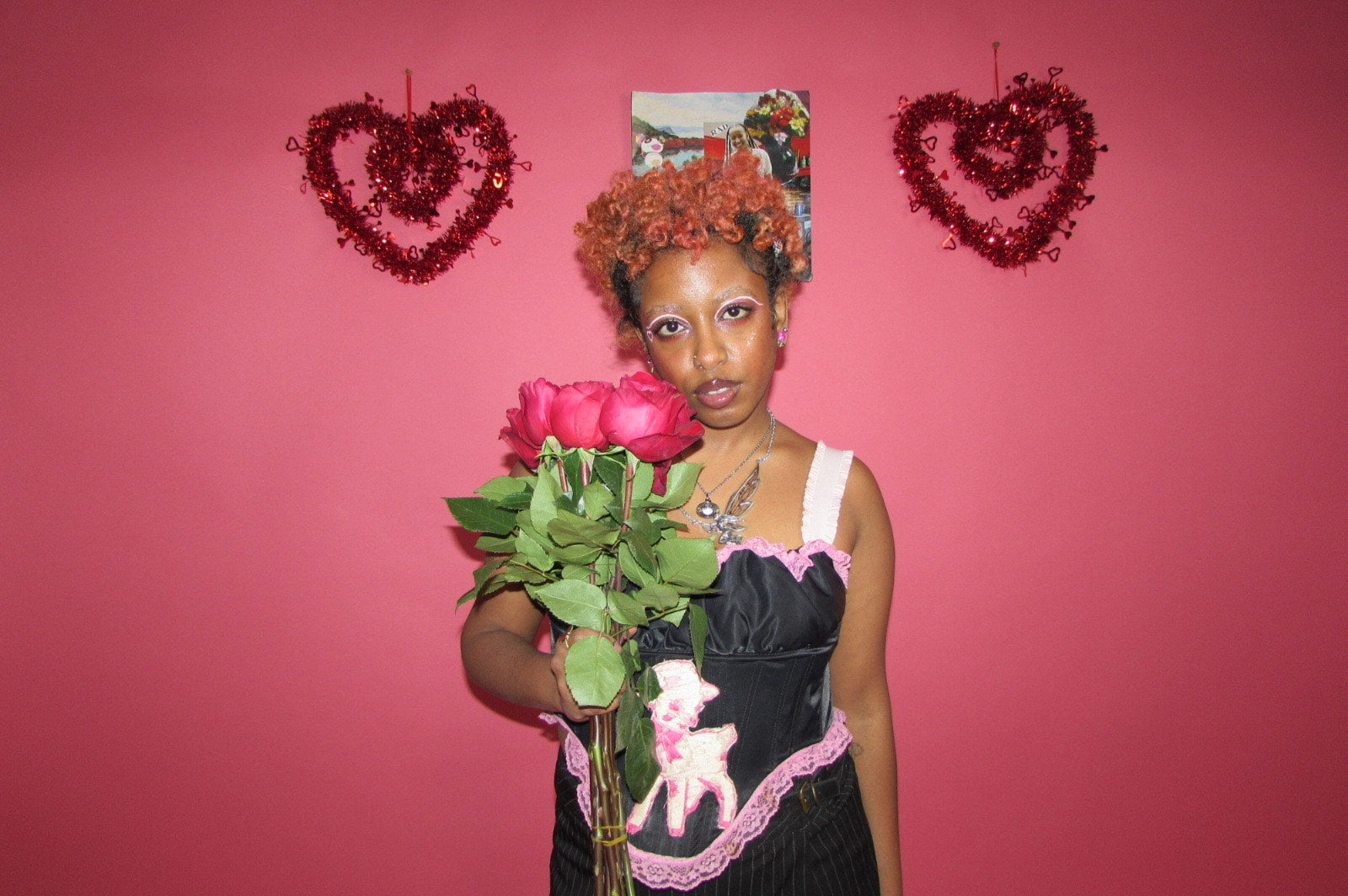 editorial studio shot of model posing with roses