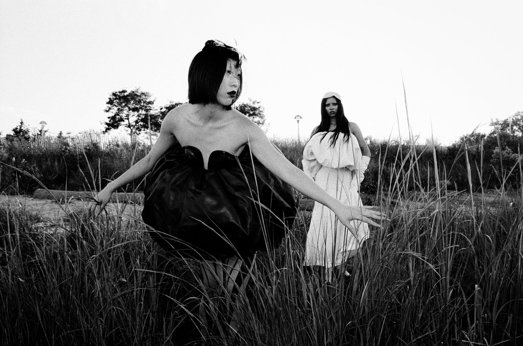editorial image of models posing in field
